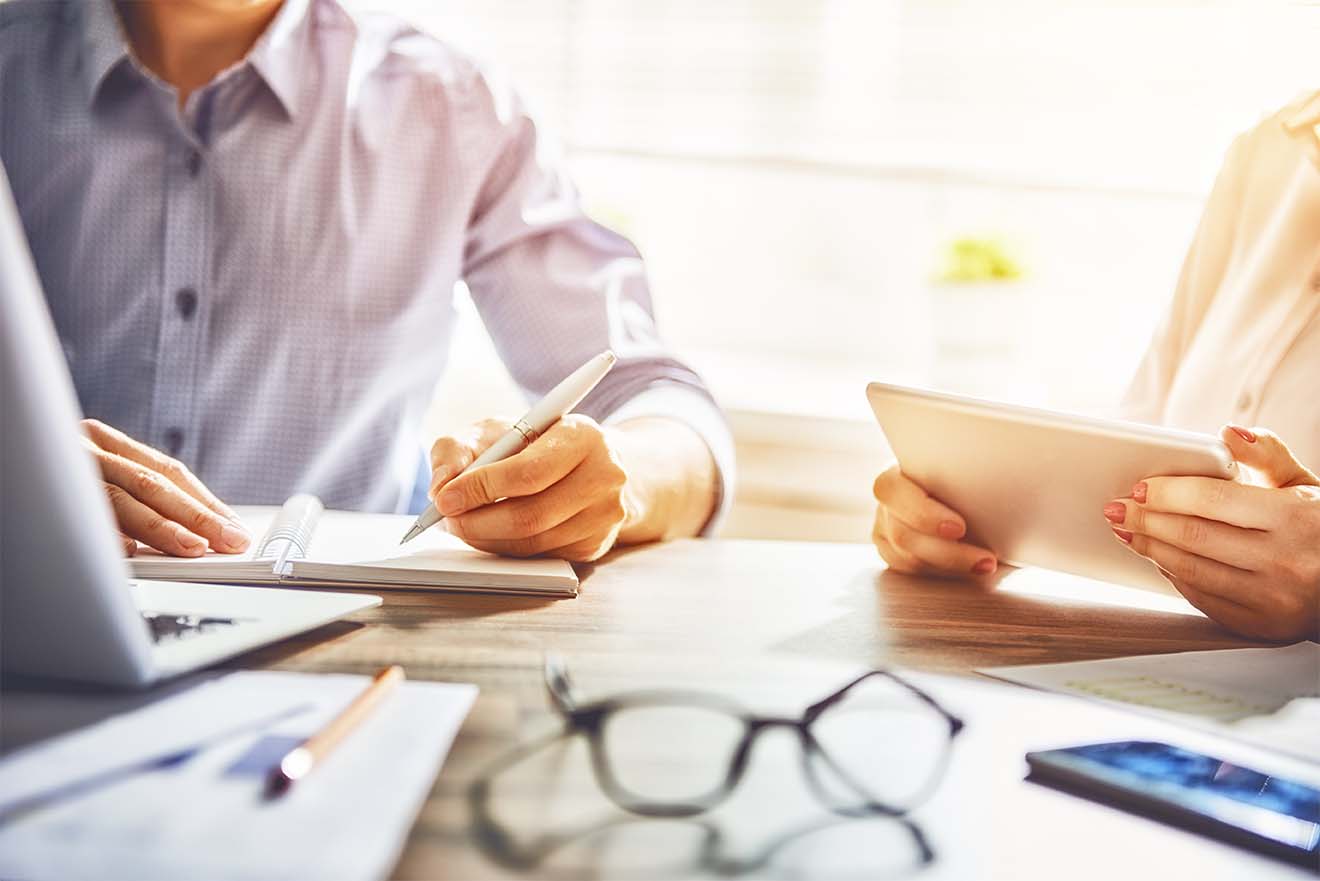 People working together with laptop and tablet