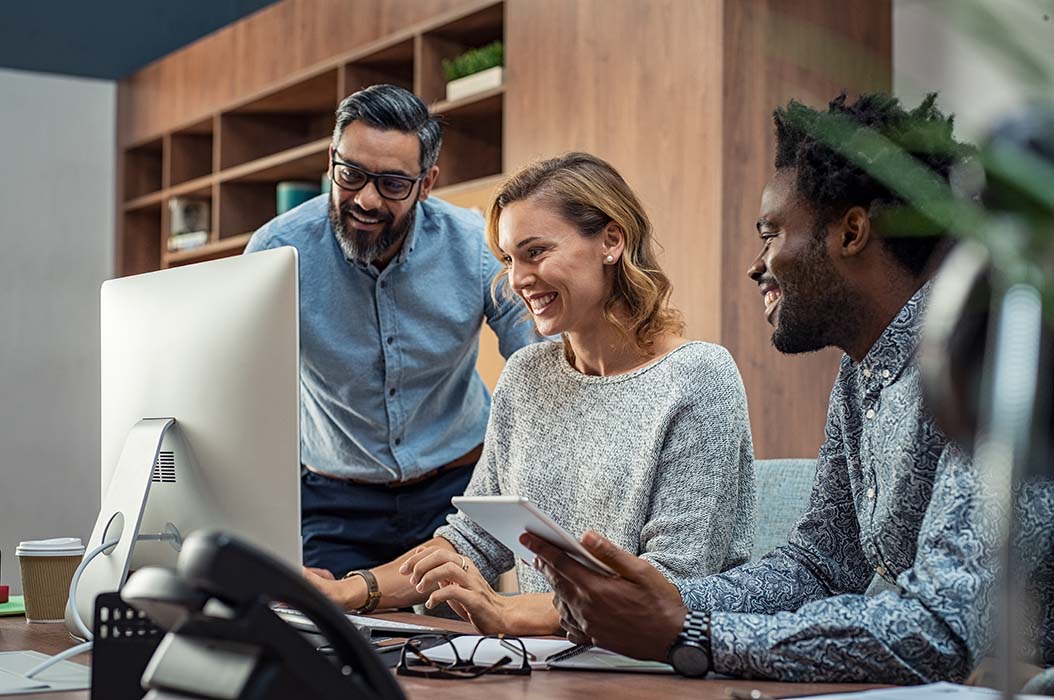 People working together around a computer